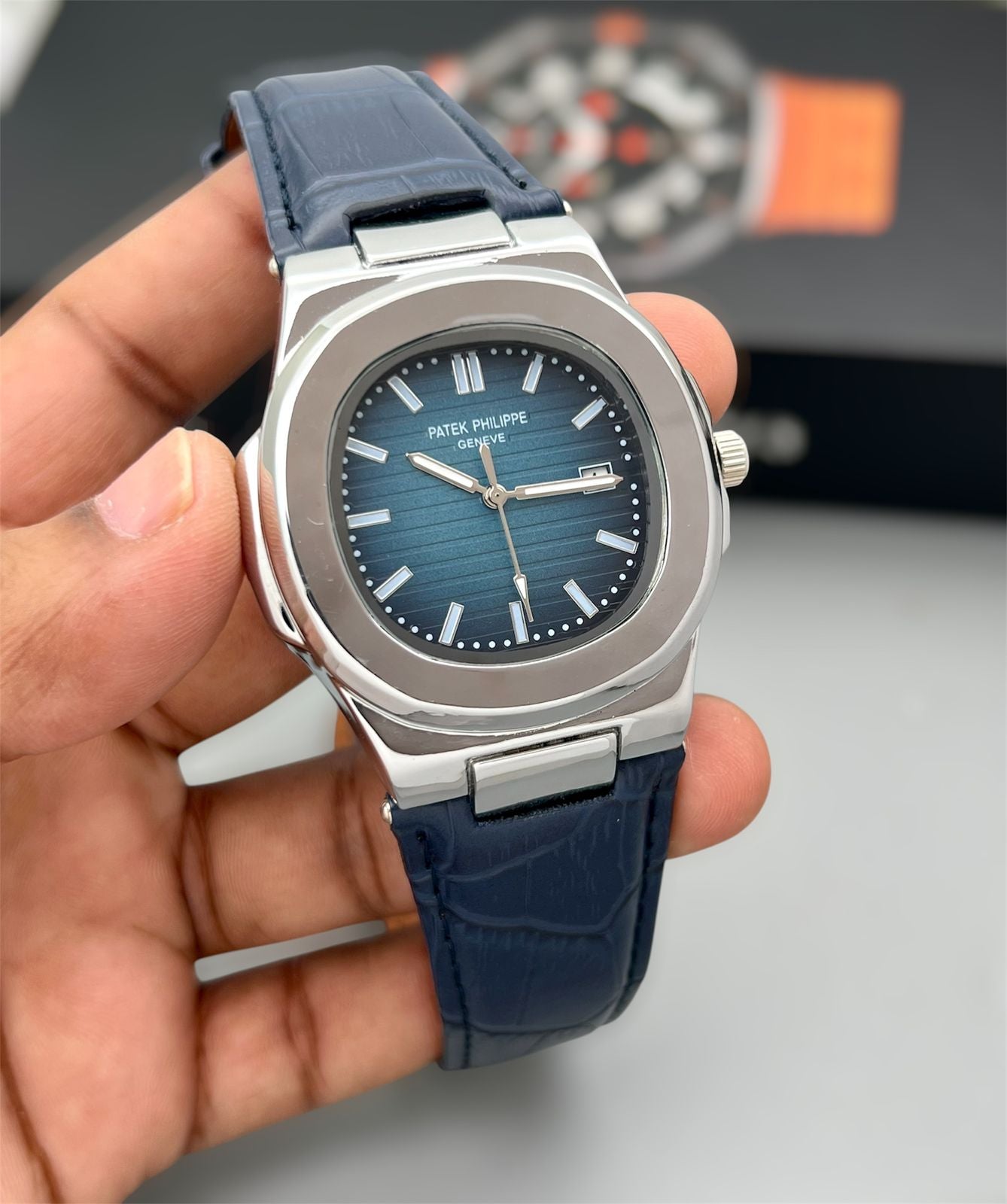 Patek Philippe Nautilus - blue dial and a blue strap.